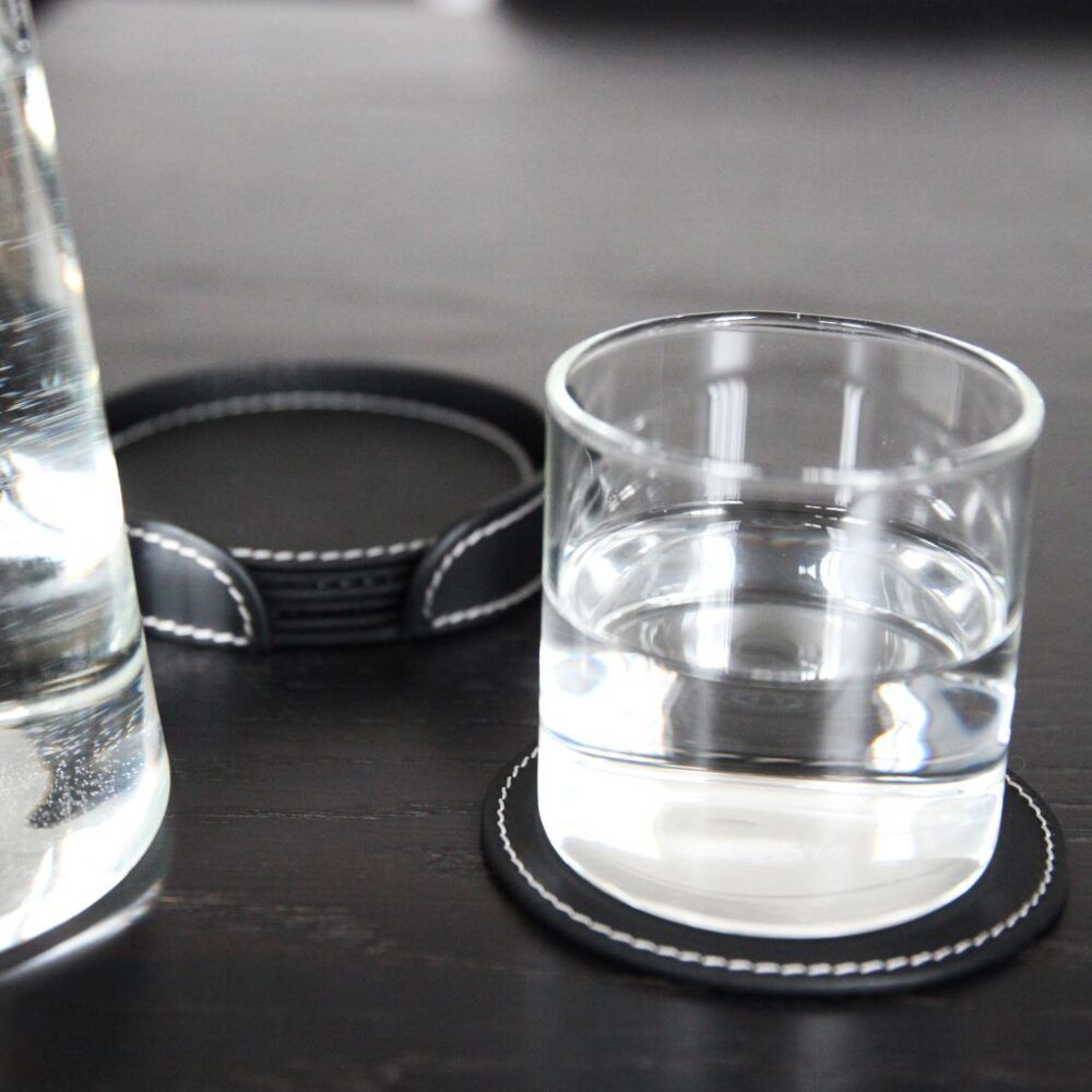 glass-from-orskov-on-round-leather-coaster